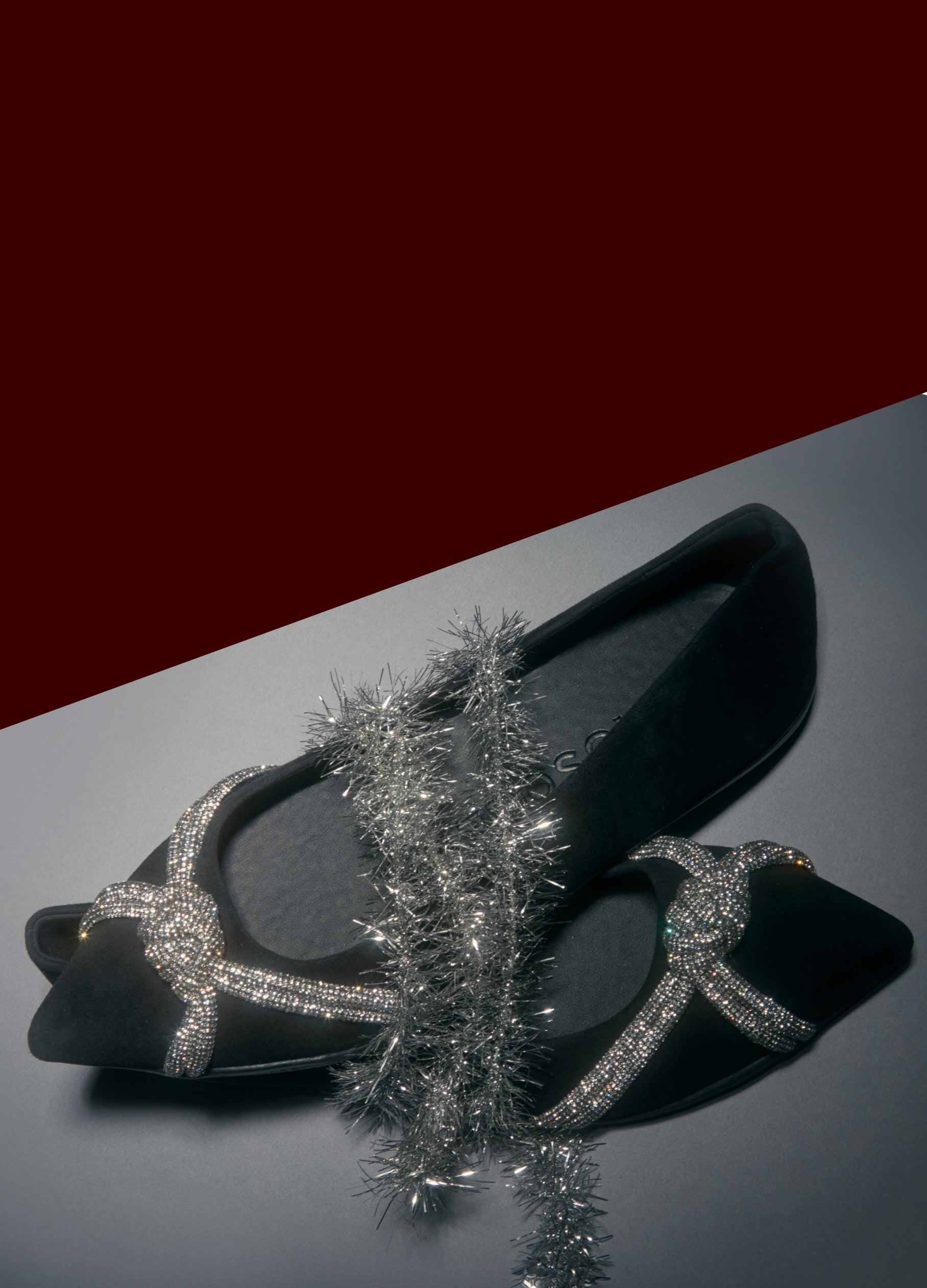 Black high-heeled shoes with silver glittery details on a dark background. 30-40% off gifting