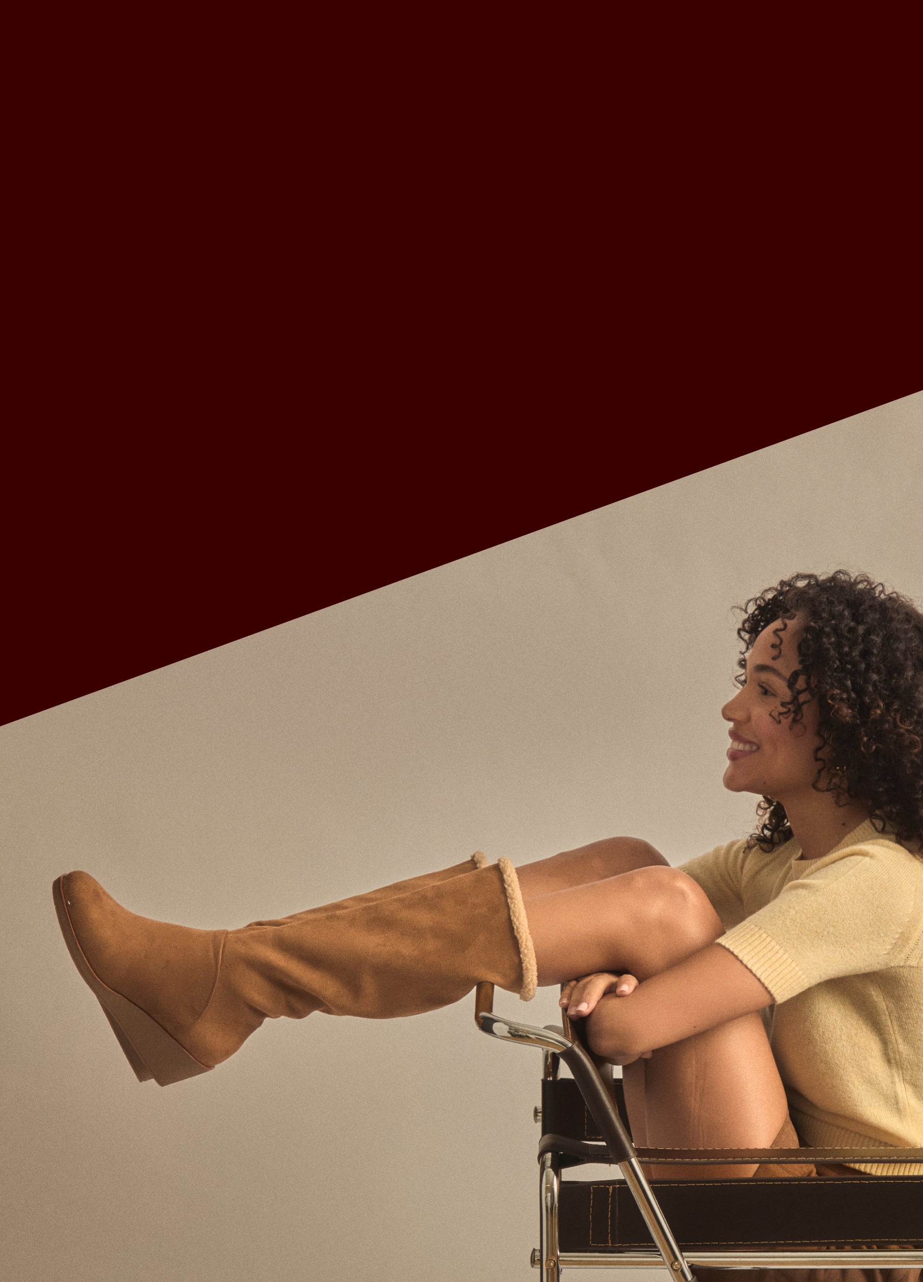 Woman sitting in a chair with one leg crossed over the other, wearing brown knee-high boots. gifts they're sure to love. winter warm up: boots 30 - 40% off shop now