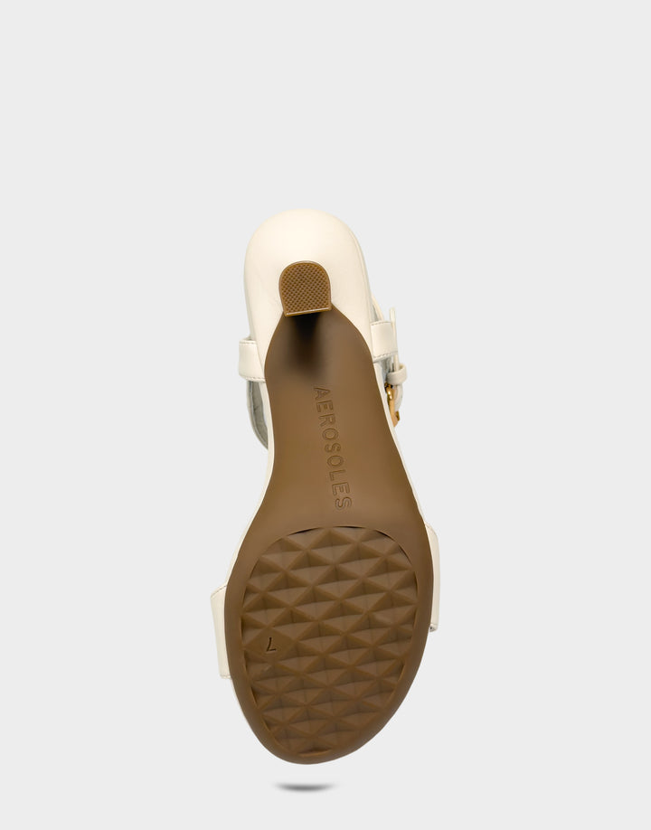 Comfortable Women's Heeled Sandal in Cream Faux Leather Bottom View