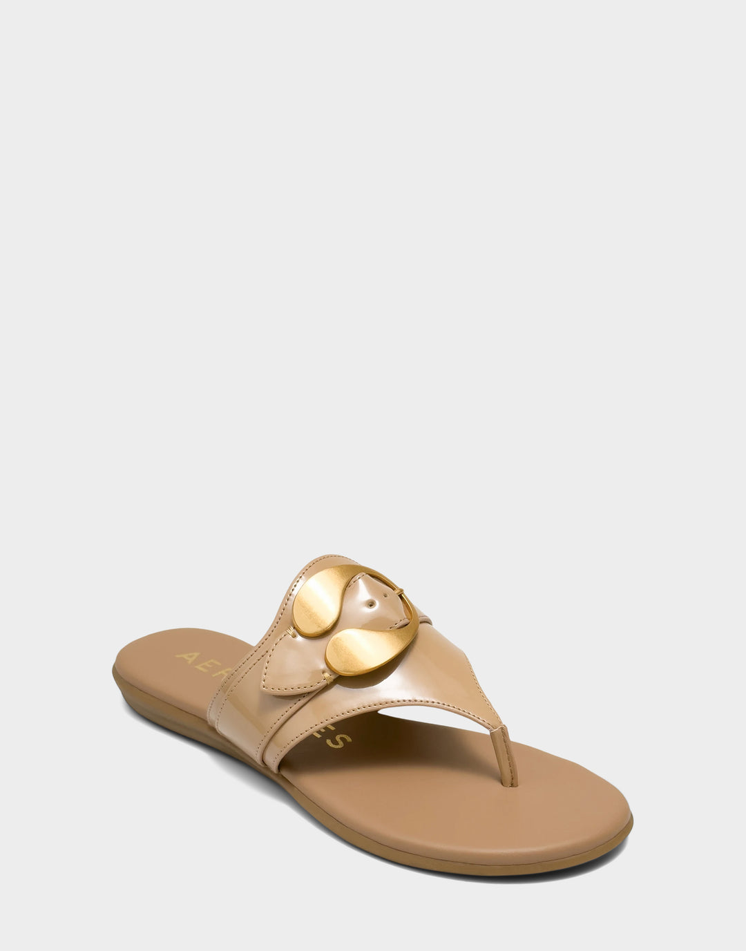 Comfortable Women's Flat Sandal in Natural Faux Patent Side Angle View