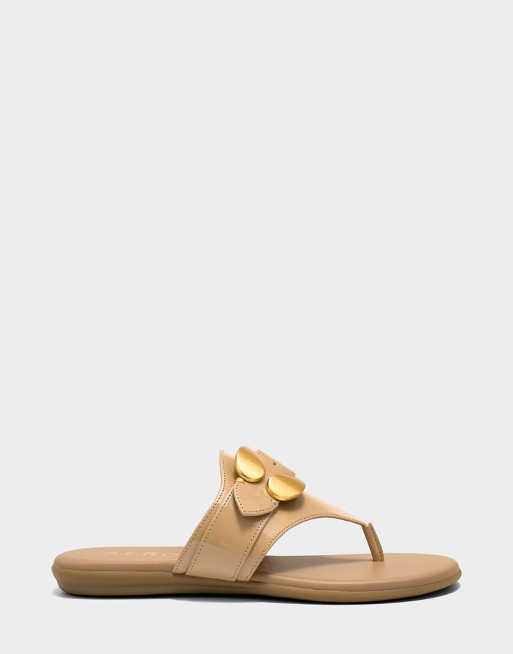 Comfortable Women's Flat Sandal in Natural Faux Patent Side View