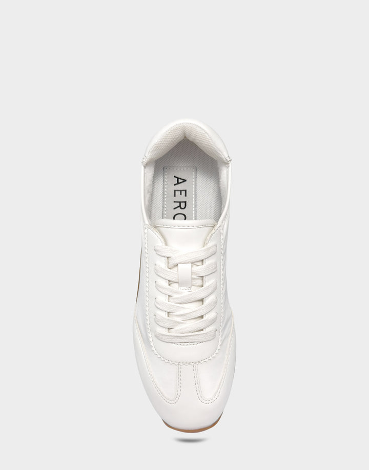 Comfortable Women's Sneaker in White/White Nylon/Faux Leather, top view 
