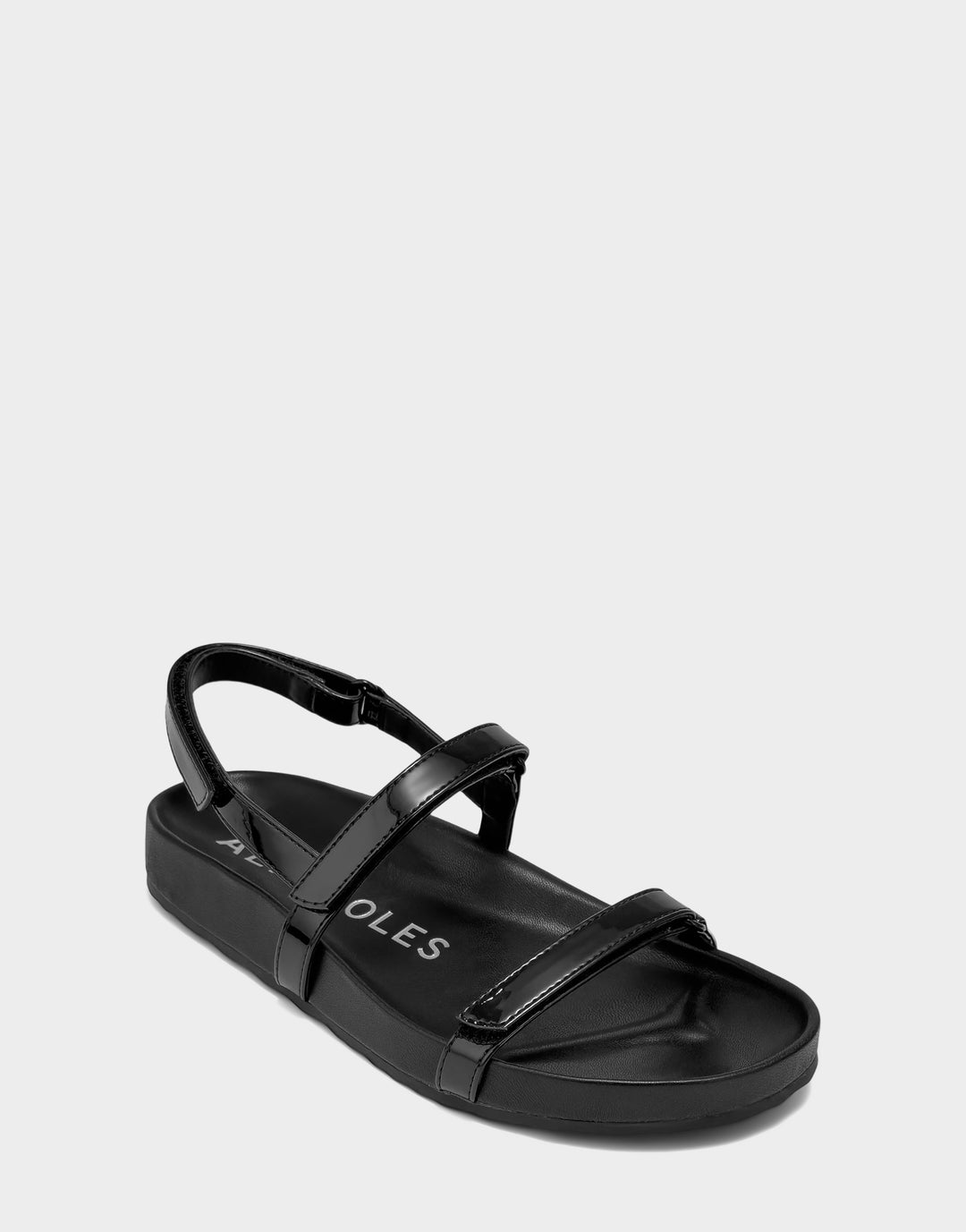 Comfortable Women's Footbed Sandal in Black Faux Patent Side Angle View