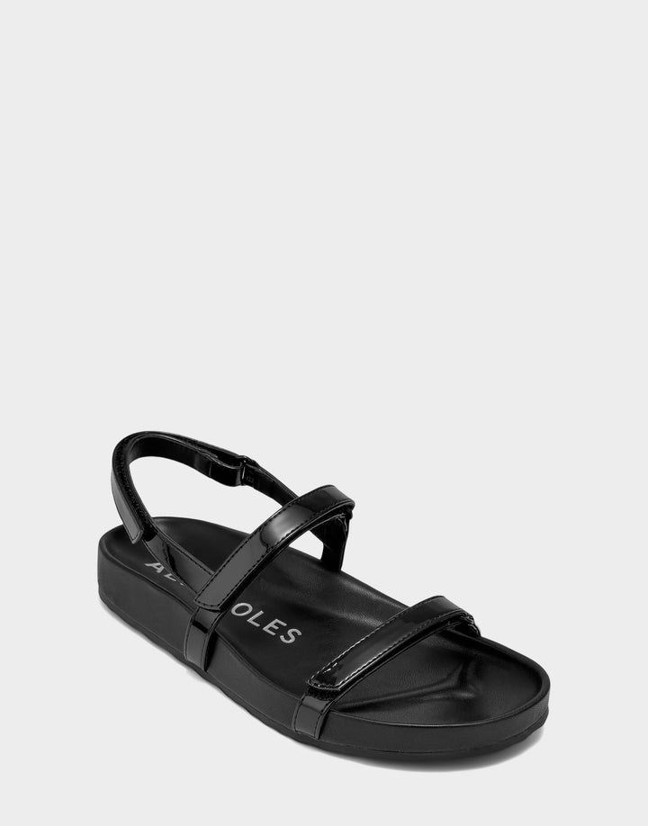 Comfortable Women's Footbed Sandal in Black Faux Patent Side Angle View