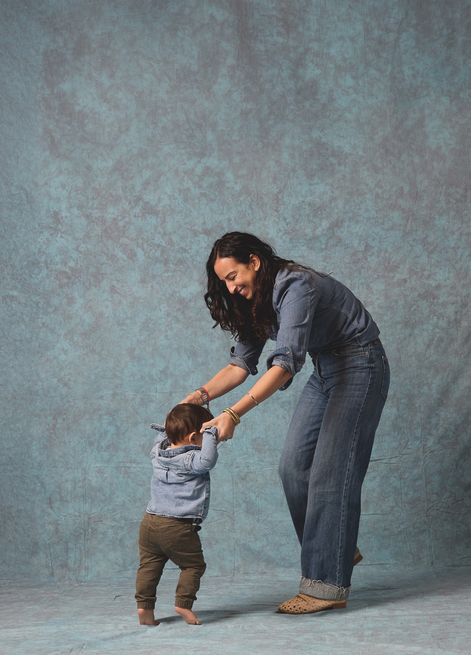 mom and son on blue textured background