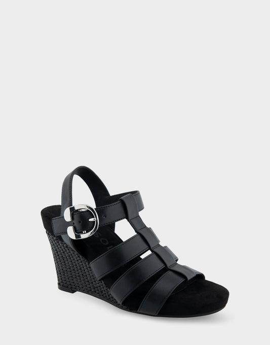 Women's Caged Footbed Wedge Sandal in Black Faux Leather