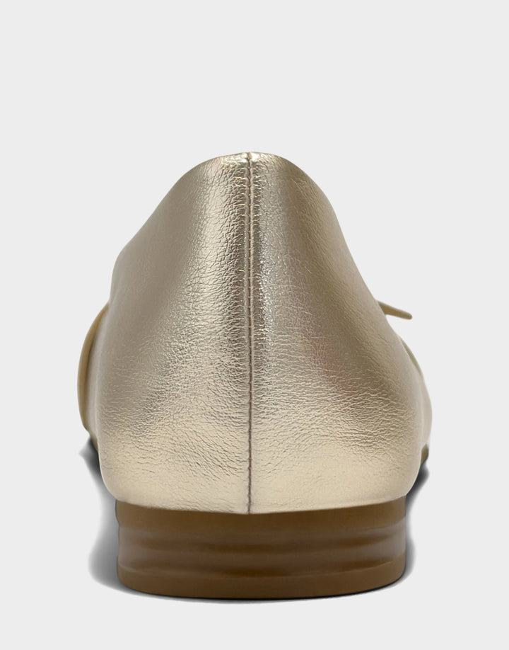 Comfortable Women's Casual Flat in Soft Gold Faux Metallic Leather, rear view 